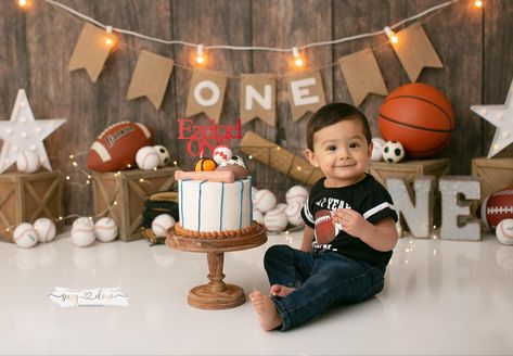 Cookie Smash Photos, Sports Theme First Birthday Cake, Football Cake Smash Session, Sports Themed Photo Shoot, Sports Cake Smash, Football Smash Cake Pictures, Sports Theme Photoshoot, Sports Smash Cake 1st Birthdays, Sports Smash Cake