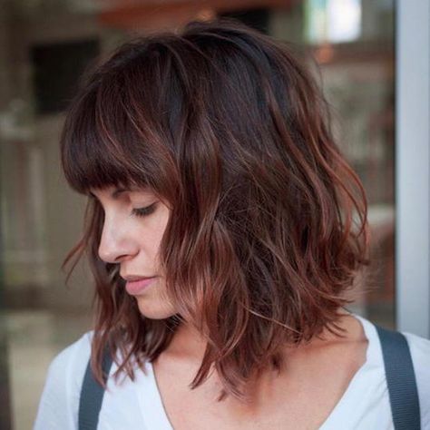 Full Bangs | We’re not sure which we love more: the full fringe or the rosy brown hair color. Either way, we’ll take it. #short #hair #trends #2019 #southernliving Long Bob With Bangs, Inverted Bob Haircuts, Stacked Bob Haircut, Medium Length Hair With Layers, Bob Haircut With Bangs, Long Bob Haircuts, Haircuts With Bangs, Short Bob Hairstyles, Brown Hair Colors