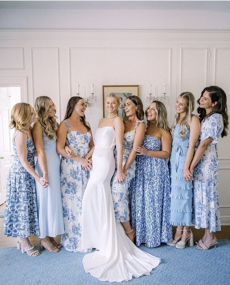 Blue Themed Wedding Dress, Solid And Floral Bridesmaid Dresses, Bridesmaid Dresses Fun, Bride With Blue Bridesmaids, Bridesmaids In Shades Of Blue, Bay Wedding Ideas, Varied Bridesmaid Dresses, Mixed Pattern Bridesmaid Dresses Blue, Bridesmaid Dresses Pastel Colors