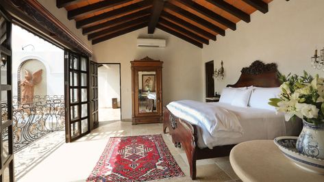 Spanish Style Bedroom Master Suite, Hacienda Style Bedroom, Carved Headboard, Exposed Rafters, Richard Burton, Antique Armoire, Puerto Vallarta Mexico, Clerestory Windows, Hacienda Style