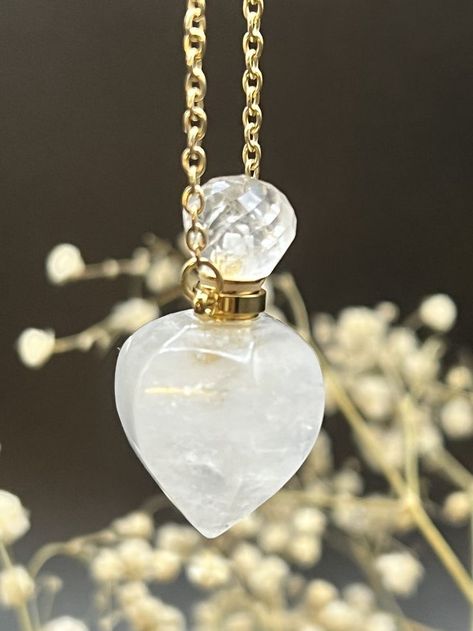 Faceted Quartz Crystal Bottle Necklace. The height if the bottle pendant is 1.4 inches and holds 1ml of liquid. it can be mounted on Gold Plated or 14k Gold Filled Necklace. Clear Quartz Crystal Heart shaped Necklace. Keychain Business, Wicca Jewelry, Crystal Bottle, White Quartz Crystal, 90s Jewelry, Essential Oil Necklaces, Vial Necklace, Spiritual Necklace, Ashes Necklace