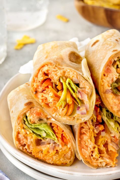 A Buffalo Chicken Wrap is the perfect easy lunch or dinner - you can even meal prep this for the week. Juicy chicken with buffalo sauce and your favorite toppings in a wrap - so delicious. Buffalo Wraps Chicken, Chicken With Buffalo Sauce, Buffalo Ranch Chicken Wrap, Franks Buffalo Chicken, Homemade Buffalo Chicken, Buffalo Chicken Wrap Recipe, Easy Chicken Wrap, Buffalo Turkey, Buffalo Chicken Wrap