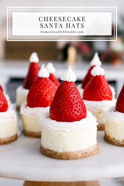 Cheesecake Santa Hats - Domestically Blissful Santa Cheesecake Hats, Xmas Cheesecake Recipes, Santa Hat Cheesecake Bites, Cheesecake Christmas Holiday Desserts, Christmas Desserts To Sell, Santa Hat Dessert, Cheesecake Santa Hats, Xmas Cheesecake, Christmas Mini Cheesecakes