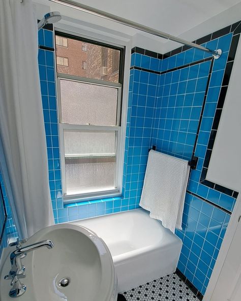 The standout feature in the “after” is the vintage-inspired tile. The floor tile is from The Home Depot, and the black and blue wall tiles are from Daltile. Credit: <a href="https://www.instagram.com/cleanqueer/">Dale Aucoin</a> Blue Wall Tiles, Vintage Blue Bathroom, 90s Bathroom, Dark Blue Tile, Best Indoor Trees, Black And White Floor, Blue Tile Wall, Tiled Wall, Kitchen Bohemian