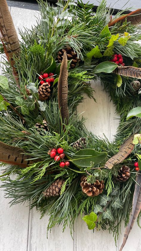 Christmas Wreaths With Feathers, Wreath Pheasant Feathers, Wreaths With Pheasant Feathers, Holly Christmas Wreath, Pheasant Feather Christmas Wreath, Christmas Wreaths Traditional, Pheasant Feather Wreath, Foraged Christmas Wreath, Pheasant Feather Decor