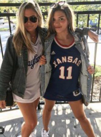 This one of the cutest gameday outfits at the University of Kansas. Ku Basketball Game Outfit, College World Series Outfit, Ku Gameday Outfit, Kansas University Aesthetic, Ku Game Day Outfits, College Football Game Outfit, Iconic Pictures, Basketball Game Outfit, Combat Boot Outfits