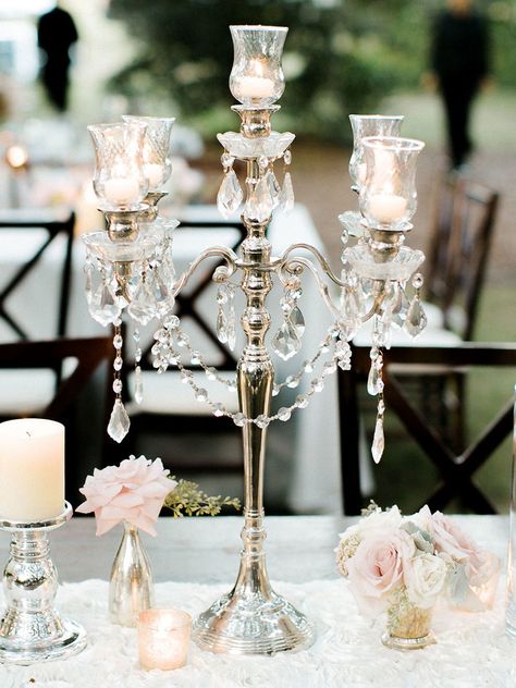 It’s time to take your wedding centerpieces up a notch with decadent sparkles, beaded embellishments and towering vases. Take a look at these 13 glamorous centerpieces with serious bling. Bling Wedding Theme, Bling Centerpiece, Silver Candelabra, Candelabra Centerpiece, Wedding Motifs, Crystal Centerpieces, Unique Wedding Flowers, Bling Wedding, Flower Centerpieces Wedding