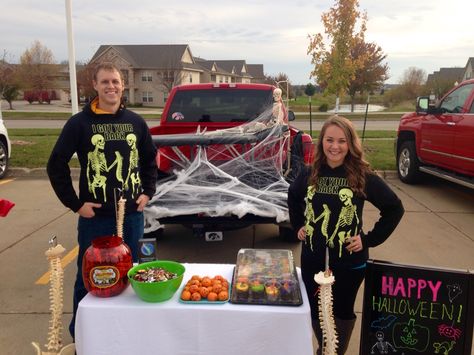 Drs. Eric & Megan with their chiropractic Trunk or Treat setup! Skeletons adjusting, "I got your back" t-shirts, and clementine jack-o-lanterns!   Herrmfamchiro.com 6110 NW 86th St. Ste 102 Johnston, Iowa 50131 515-276-4946  #halloween #trunkortreat #chiropractic Health Fair, I Got Your Back, Trunk Or Treat, Got Your Back, Chiropractic, Your Back, Jack O Lantern, Iowa, Trunk