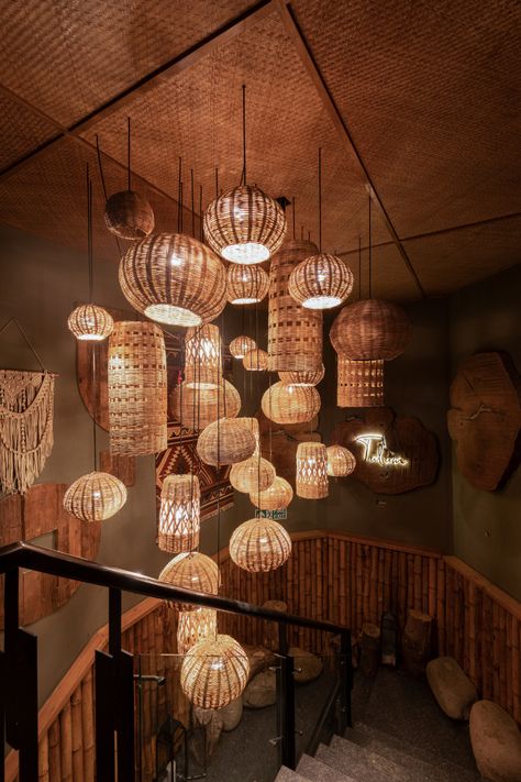 Loop Design Studio takes you on a safari at the Tulum Restaurant in Chandigarh - ArchitectandinteriorsIndia Jungle Chandelier, Tulum Jungle, Restaurant Design Rustic, Tulum Restaurants, Rattan Light Fixture, Rustic Restaurant, Bamboo Light, Bamboo Lamp, Rattan Lamp