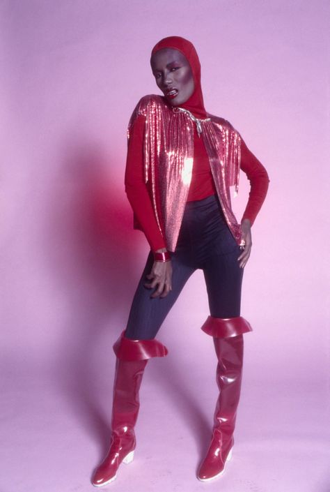 26 of Grace Jones' Most Perfect, Iconic, Outrageous Looks Jean Paul Goude, Taylor Dayne, Disco Queen, Black Straw Hat, Diesel Clothing, Kim Wilde, Purple Suits, Elisabeth Ii, Grace Jones