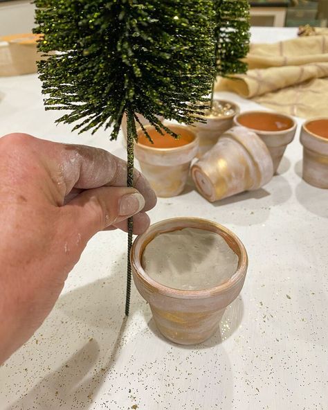 I am going to show you the easiest DIY using bottle brush Christmas trees.These little trees are everywhere during the holiday season.This fun bottle brush Christmas tree DIY will give you such a wow factor on your dining room table, your coffee table, your kitchen counters, ……Supplies sugar mold 2.5″ terra cotta pots (I used 12, it will depend on the number of holes your sugar mold has. brush trees without the wood base ( I used 12, and used a combination of dark green, light green… Sugar Molds Decor, Bottle Brush Christmas Tree, Brush Christmas Tree, Diy Will, Potted Christmas Trees, Bottle Trees, Terra Cotta Pots, Sugar Mold, Buffalo Plaid Christmas Tree