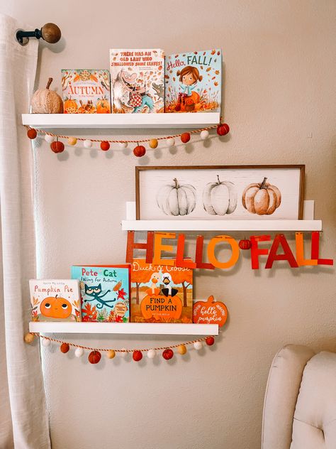 Fall books are from Amazon, Target and Walmart. Felt ball fall garland and the pumpkin canvas sign is from Homegoods and the “Hello Fall” banner is made using a cricut! Toddler Bookshelf, Crafts By Month, Fall Books, Pumpkin Canvas, Fall Tv, Pumpkin Garland, Fall Banner, Fall Garland, Toy Display