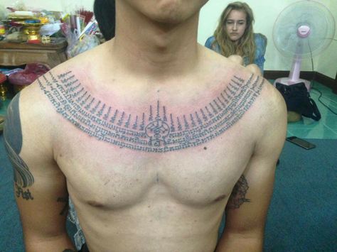 Traditional Thai Tattoo Sak Yant Sangwan (necklace) - Arjarn Pi Bangkrating (Chiang Mai Thailand) Sak Yant Chest Tattoo, Thai Chest Tattoo, Thai Tattoos, Traditional Thai Tattoo, Buddhist Tattoo, Borneo Tattoo, Tattoo Chest, Thailand Tattoo, Necklace Tattoo