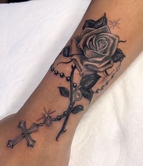 Rosary Rose Tattoo, Cross With Roman Numerals Tattoo, Rosary Tattoo Forearm Women, Rosary Wrist Tattoo For Women, Rosary Leg Tattoo, Rose Tattoo With Rosary, Side Ankle Tattoos For Women, Rosary Hand Tattoo, Rose And Rosary Tattoo