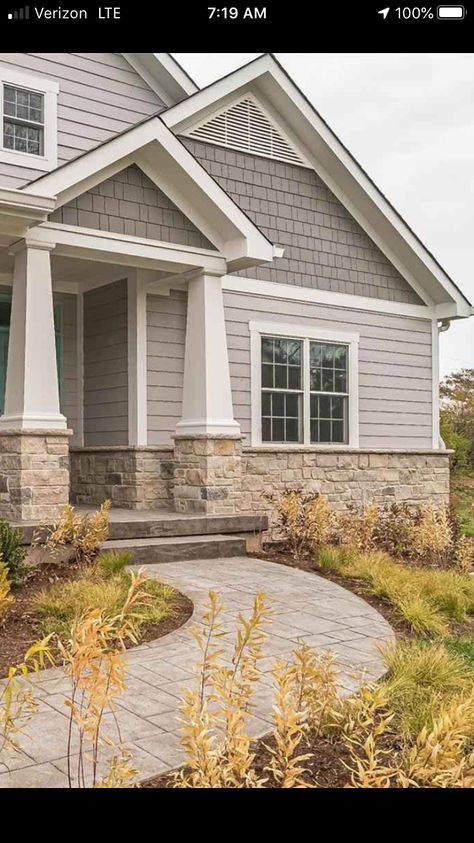 Modern Exterior Colors For House, Exterior House With Stone, Grey House With Stone Accents, Cream And Blue Exterior House, Light Home Exterior Colors, Stone Beach House Exterior, Neutral Siding Colors Exterior, Vinyl And Stone House Exterior, Shake Exterior Siding