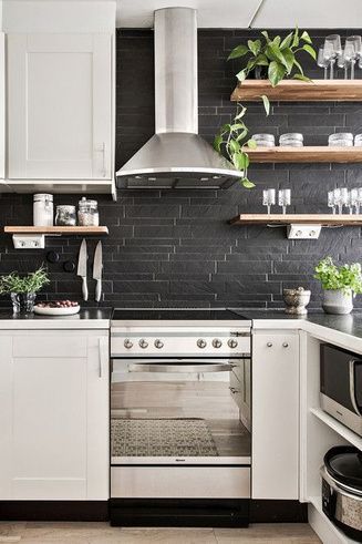 Are you considering a kitchen makeover?  Black tile in kitchens is a new trend that we love. Black tile in the kitchen can be super shiny or moody matte. Whether you are doing a kitchen makeover or just updating Black tile in the kitchen is the way to go. Keep reading as we share The ultimate guide to using black tile in your kitchen. Hadley Court Interior Design Blog by Central Texas Interior Designer, Leslie Hendrix Wood. Matte Black Backsplash, Black Tile Kitchen, Black Splashback, Black Tiles Kitchen, Tile In The Kitchen, Greige Kitchen, Moody Kitchen, Matte Black Kitchen, Black Backsplash