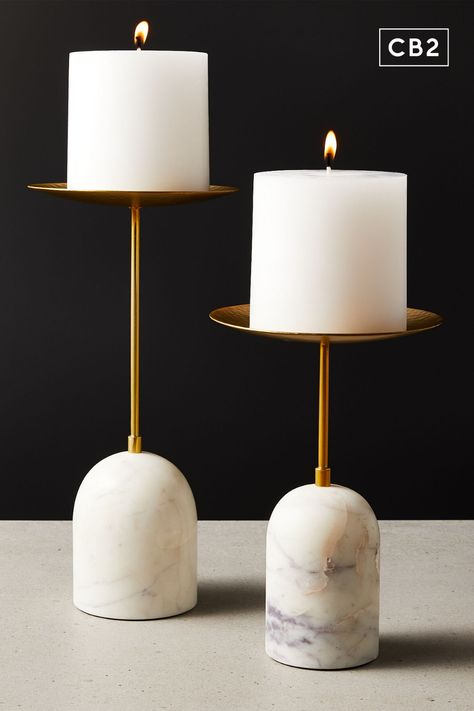 Smooth white carrara marble rounds out the base of this hand-hammered brass pillar candle stand. Cb2 Candle Holder, Pillar Candle Stand, Wood Pillar Candle Holders, Marble And Brass, Marble Candle Holder, Candle Stands, Unique Candle Holders, Road House, Modern Candle Holders