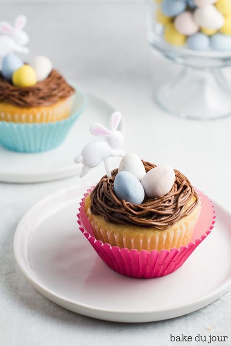 Prepare to wow everyone at your upcoming Easter gathering! These Easter Egg Cupcakes feature a simple yellow cake, topped with a smooth chocolate buttercream frosting. And let\'s not forget the real winner here: the Cadbury mini eggs! #eastereggcupcakes #cupcakes #easterdessert | bakedujour.com Simple Yellow Cake, Cadbury Mini Eggs, Jam Thumbprint Cookies, Egg Cupcakes, Easter Gathering, Chocolate Buttercream Frosting, Easy Cupcakes, Sweet Recipes Desserts, Mini Eggs