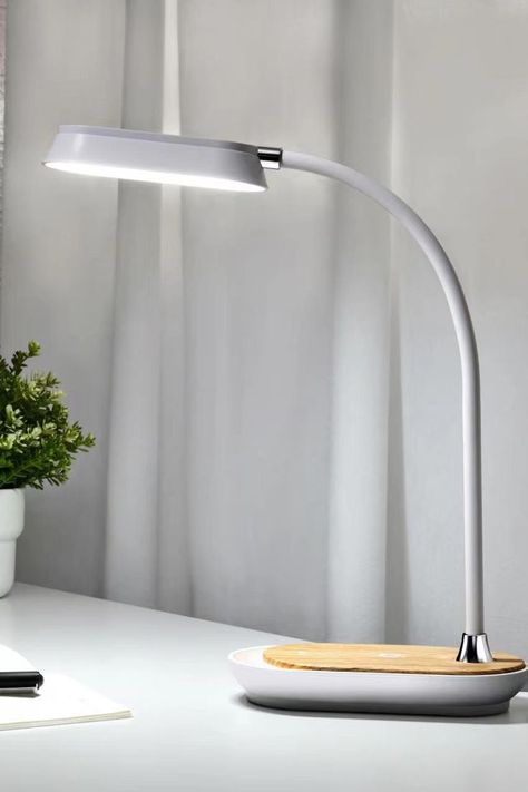 Demand the most from the least, this small boat-like desk lamp create a soft setting for working or studying. Easily adjust the lamp's gooseneck to orient the light beam exactly where it is necessary. It features wireless charging. You can charge your smartphone while working, studying and relaxing, which is very convenient. Light Beam, Small Boats, Bedside Lamp, The Light, Lighting Design, Desk Lamp, Wireless Charging, Beams, Smartphone