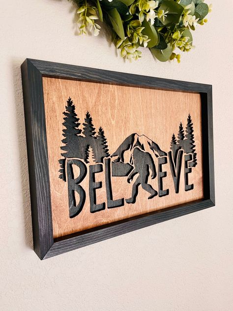 "Believe Bigfoot  Sasquatch Themed Wooden Sign, Rustic Home Decor, Wooden Framed Bigfoot Believer Sign, Cabin Decor, West Coast Bigfoot Final sign sizes, with frame, are roughly 10\"x15\"  Each sign is custom made to order in our shop. ** We do NOT provide hanging materials ** They can, however, be easily hung using small nails to hang items.  Saw-tooth hangers can also be added, though we typically hang our signs from the frame, using only small nails.  Current turnaround time on items is appro Bunkhouse Sign, Diy Signs Wooden, Bigfoot Decor, Laser Art Wood, Cnc Signs, Home Wooden Signs, Small Nails, Laser Cut Wood Crafts, Wood Art Projects