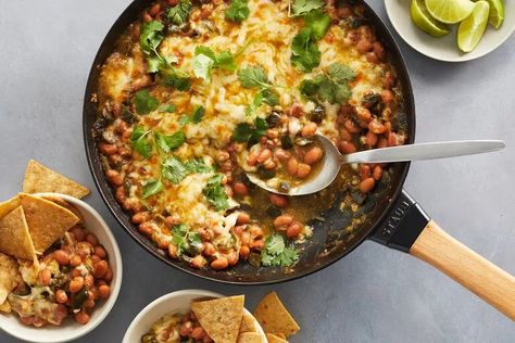 Cheesy Green Chile Bean Bake Recipe - NYT Cooking Cheesy Green Chili Bean Bake, Bean Bake, Green Chili Enchiladas, Chili Bean, Easy Skillet Dinner, Homemade Salsa Verde, Enchilada Bake, Easy Skillet, Nyt Cooking