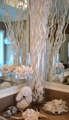 Beach reception centerpiece. Good "tall centerpiece" option. Corkscrew willow, coral, substantial shells. Coastal Style Bathroom, Mermaid Bathroom Decor, Deco Marine, Tall Glass Vase, Mermaid Bathroom, Summer Deco, Smart Tiles, Beach Theme Bathroom, Beach Room