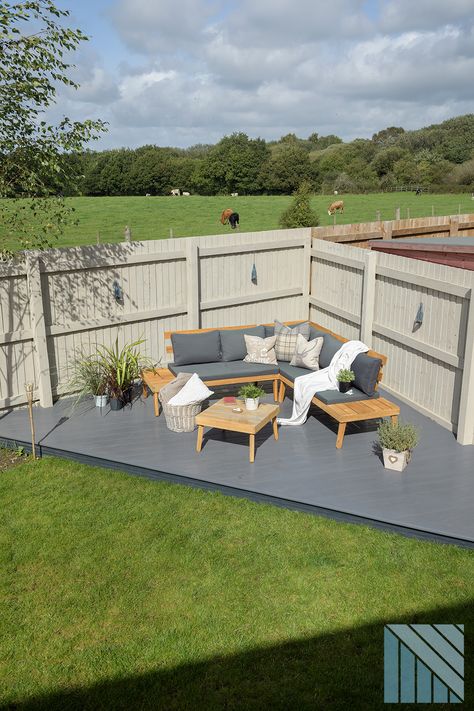 Modern garden design with anthracite grey decking Decking For Small Gardens, Decking Ideas Garden Small Backyards, Small Corner Garden Design, Decked Patio Ideas, How To Design A Backyard, Decking Seating Area, Triangle Decking Ideas, Garden Decking Area, Small Garden Designs Layout