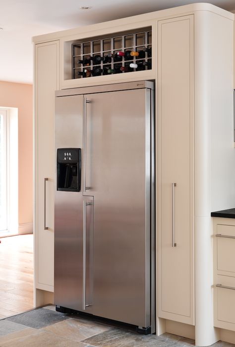 An example of a housing for an American fridge-freezer with pull-out larders and oak wine rack.  #kitchendesign #bespokekitchens Built In Fridge Freezer, American Fridge Freezer, Temecula Wineries, Larder Cupboard, American Fridge, Larder Unit, American Fridge Freezers, Built In Cupboards, Kitchen Fridges