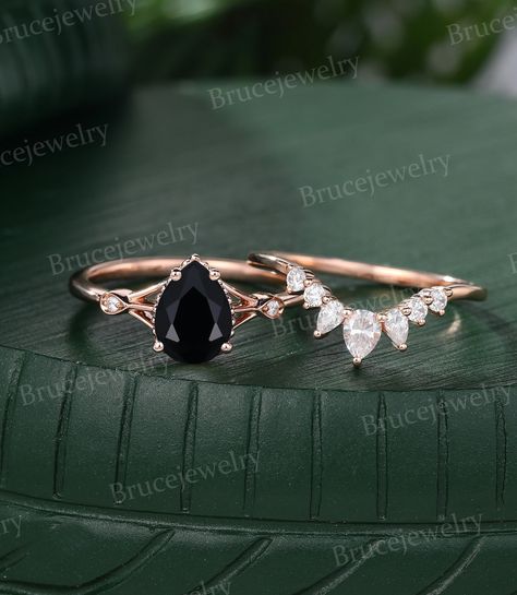 Pear shaped Black Onyx Engagement ring set Vintage Rose gold Pear shaped Moissanite ring Diamond Wedding ring set Anniversary ring for her ~~About Rings~~ The engagement ring: ~Main Stone: 6*8mm Pear shaped Black Onyx ~Side Stone: 0.016ct Moissanite or 0.016ct Diamond ~The band width is about 1.5mm The wedding band: Stone: 0.3ct Moissanite or 0.3ct Diamond ~The band width is about 1.3mm The material is solid gold(14k/18k White, Yellow, Rose gold available). Ring size can be chosen from the drop menu(3US-9US can be chosen from the drop menu, Please contact me for other ring size). Need other gemstones or metal , Please contact me for a quote. ~~Production Time~~ All rings are handmade to orders, it will take 2 to 3 weeks, If you are in a hurry, Please contact me before placing the order. ~~ Pear Shaped Black Diamond Ring, Black Diamond Pear Engagement Ring, Black And Gold Wedding Ring, Black Stone Ring Engagement, Anniversary Rings For Her, Black Onyx Engagement Ring, Onyx Engagement Ring, Black Wedding Rings, Vintage Rose Gold