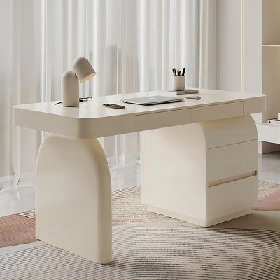 Embrace the gentle touch of cream style with our desk, featuring a simple and clean design that brings warmth and elegance to your home life. The desk's edges and corners are thoughtfully designed with rounded shapes, ensuring both beauty and safety for you and your family. The multi-layered solid wood construction promises a stable and durable desk for a decade. The spacious desktop easily accommodates various small items, while the sturdy solid legs provide ample legroom. The environmentally f Home Office Inspiration Small Space, Cute Desks For Bedrooms, Simple Desk Ideas, Rounded Desk, White Modern Desk, Desk Luxury, Corner Standing Desk, Beauty Desk, Designer Desk