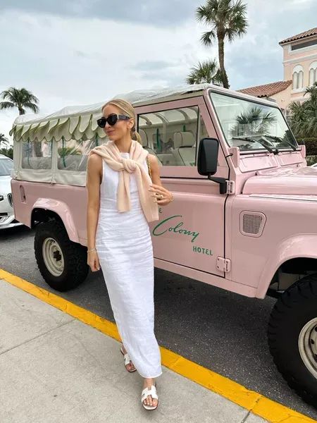 My outfit for a day in Palm Beach! I wore a white linen dress and tied a pink cashmere sweater around the neck (which I packed to wear with jeans too). Tap to shop and bring this fashion inspo to life! White Summer Dress Outfit, White Dress Outfit Summer, Palm Beach Fashion, Beach Style Outfit, Pink Cashmere Sweater, Midi Dress Outfit, Florida Outfits, Palm Beach Style, White Linen Dresses