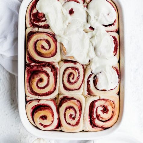 Raspberry sweet rolls being frosted with white chocolate icing. Bread Braids, Raspberry Sweet Rolls, Chocolate Raspberry Cake Recipe, White Chocolate Icing, White Chocolate Desserts, Food Portfolio, Chocolate Roll, Raspberry Filling, Brunch Time