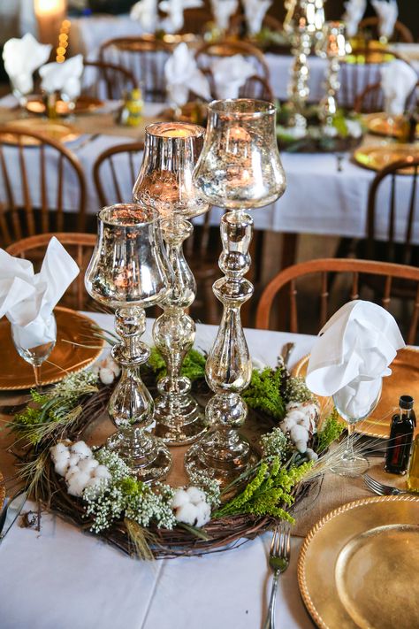 Rustic Wreaths and Mercury Glass Centerpieces Winter Wedding Flower Arrangements, Floating Tea Candles, Winter Wonderland Wedding Centerpieces, Mercury Glass Centerpiece, Mercury Glass Wedding, Christmas Wedding Centerpieces, Rustic Wreaths, Gold Votive Candles, Winter Wedding Centerpieces