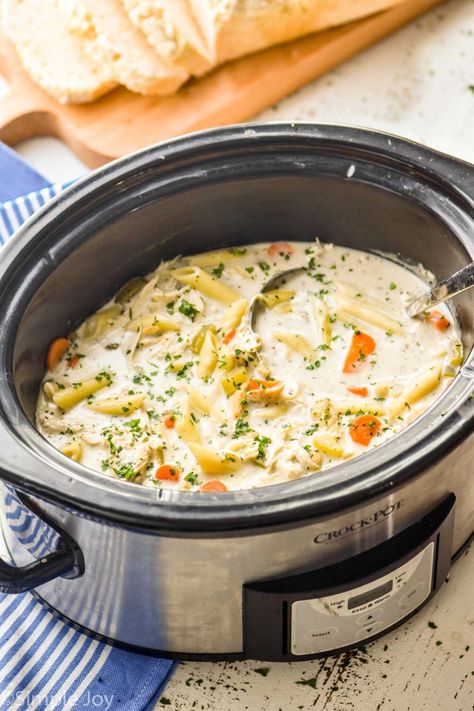 Our family loves this Creamy Crockpot Chicken Noodle Soup. It is the ultimate comforting winter soup. It is easy to make, but deliciously thick and creamy. Chicken Soup Crock Pot, Slow Cooker Tortellini Soup, Soup Crock Pot, Creamy Crockpot Chicken, Creamy Chicken Noodle, Easy Chicken Soup, Chicken Noodle Soup Crock Pot, Creamy Chicken Noodle Soup, Easy Crockpot Chicken