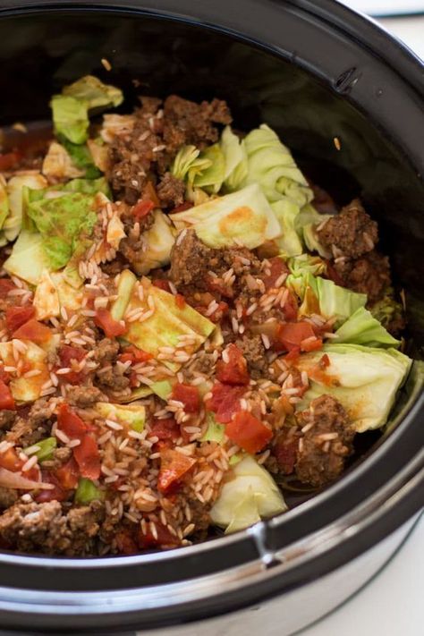 This hearty and savory Crock Pot Cabbage Roll Casserole is cooked in a rich tomato sauce, full cabbage, beef and herbs! Super easy to make, this Crock Pot Cabbage Roll Casserole makes for a perfect weeknight meal! #crockpot #slowcooker #casserole #cabbage #glutenfree #groundbeef #maindish #dinner | recipesworthrepeating.com Cabbage Roll Casserole With Rice, Crockpot Cabbage Recipes, Cabbage Beef, Casserole With Ground Beef, Ground Beef And Rice, Cabbage Casserole Recipes, Cabbage Roll Casserole, Crock Pot Cabbage, Unstuffed Cabbage