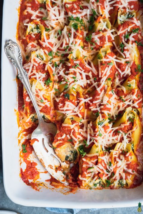 Loaded with homemade tofu ricotta and spinach, and topped with vegan cheese and homemade marinara sauce, these Vegan Stuffed Shells are a holiday entree  that everyone is going to love. #sweetsimplevegan #veganrecipe #stuffedshells #ricottastuffedshells #veganricottacheese #vegancheese #pastabake #entree #veganentree #holidayentree #dairyfree #eggfree Holiday Entrees, Vegan Stuffed Shells, Ricotta Stuffed Shells, Spinach Stuffed Shells, Tofu Ricotta, Stuffed Shells Ricotta, Homemade Tofu, Vegan Ricotta, Ricotta Recipes