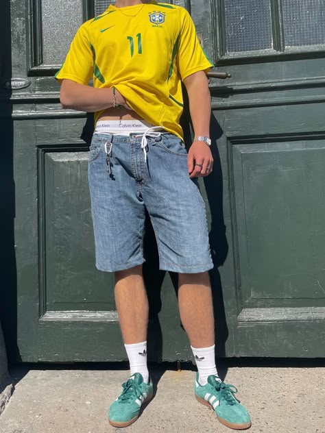 #blokecore #brazil #shirt #football #soccer #kit #outfit #jorts #adidassamba #sambas Brazil Bloke Core, Guy Jorts Outfit, Brazil Tshirt Outfits, Summer Jorts Fits, Brazil Soccer Jersey Outfit, Brazil Shirt Outfit Men, Soccer Kit Outfit, Brazil Outfit Men, Football Shirts Outfit