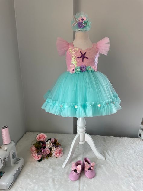 Along with the dress, a mermaid themed hair clip is sent as a gift. 🎁 Handmade dresses for your baby are prepared with soft cotton lining. It has a zipper on the back, very easy and comfortable to wear. The hologram mermaid is made with sequins. 👉🏻 choose the shoes along with the dress for the shoes 👉🏻 you can leave a message for more questions 👉🏻 It is a handmade dress that we can prepare for the person. Very dense tulle layers are used, very fluffy, personalized color options are availa Mermaid Hair Clip, Costume Mermaid, Mermaid Shoes, Baby Costumes Girl, Tutu Dresses, Dress Mermaid, Mermaid Costume, Most Beautiful Dresses, Handmade Dress