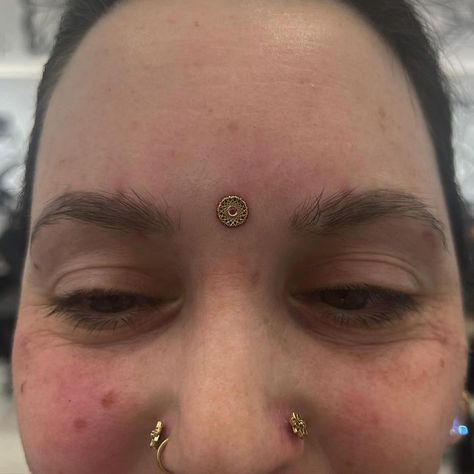 👁️ C U THIRD EYE PIERCING (FOREHEAD DERMAL) DONE BY @mosocelpiercings 14K GOLD JEWELRY FROM @invictus_bodypiercing Soho, Union Square, and Williamsburg 11AM-9PM 7 DAYS A/W🕘 WALK-INZ OR BOOK ONLINE..📕 TATTOOS & PIERCINGS, NO ATTITUDE, NO MISERABLE HOOPS TO JUMP THROUGH....🚫 WALK-INZ WELCOME OR BOOK ONLINE AT ⚔️livebytheswordtattoo.com⚔️ . . . . #foreheaddermal #dermal #dermalpiercing #invictusbodypiercing #bodymod #soho Forehead Dermal Piercing, Dermal Under Eye Piercing, Facial Dermal Piercing Eye, Third Eye Dermal, Dermal Piercing Face Jewelry, Chest Dermal Piercing Center, Third Eye Piercing, Eye Piercing, Dermal Piercing