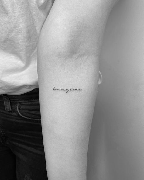 Small Writing Arm Tattoo, One Word Arm Tattoo, Single Needle Word Tattoos, Fine Line Word Tattoo Arm, Simplicity Word Tattoo, Imagine Tattoo, Limitless Tattoo, Elbow Tattoos, Tattoo Script