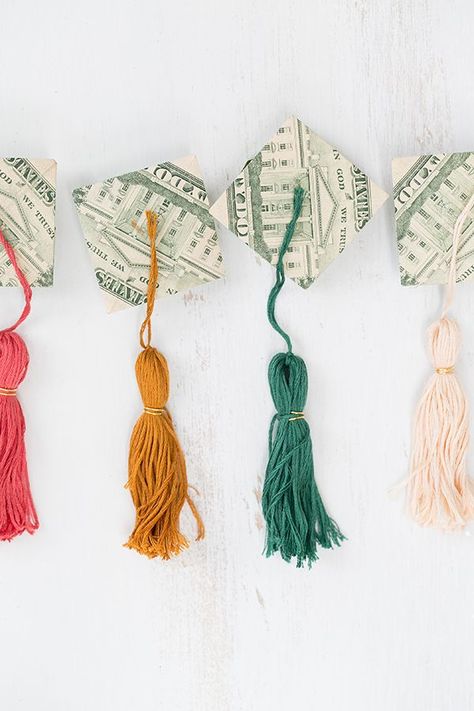 Once spring hits, we start thinking up unique graduate gifts that involve money! One year, we added money to balloons and now we’ve made the most charming origami money graduation caps and tassels to go with them! These little money grad caps are much more exciting than just plopping cash in a card! To make the hats, there are some really great...read more Graduation Cap Tassel, Origami Money, Folding Money, Graduation Tassel, Graduation Money, Graduation Leis, Creative Money Gifts, Origami Love, Folding Origami