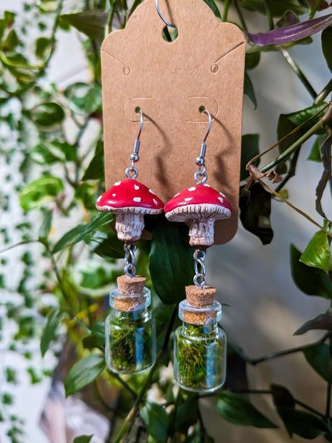 The cutest handmade mushroom & moss jar earrings ! These are handmade polymer clay mushrooms with surgical steel earrings for every mushroom loving person you know. Each mushroom is approximately 1 inch in diameter ❤️ *If you would like a different size or color please feel free to message me* Moss Jar, Polymer Clay Mushrooms, Jar Earrings, Clay Mushrooms, Mushroom Core, Earrings Cottagecore, Polymer Clay Mushroom, Cottagecore Mushroom, Mushroom Crafts