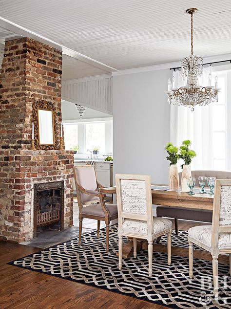 Unexpected trials and treasures during a major renovation of a 1901 house left these DIY newbies with a place worthy to call home. #oldhome #renovation Exposed Fireplace Living Room, Chimney In Dining Room, Exposed Chimney Living Room, Large Fireplace Makeover, 1890s Fireplace, Exposed Brick Fireplace Living Room, Exposed Chimney, Fireplace In Dining Room, Tudor Fireplace