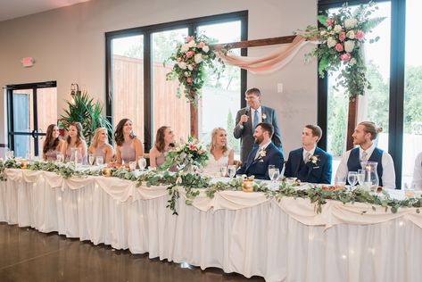 Outdoor Wedding Head Table Ideas, Long Flower Arrangements Head Tables, Head Table With Loveseat, Big Head Table Wedding, Made Of Honor Table, Bridal Head Table Decorations, Bride Groom Head Table, White Rose Head Table Wedding, Head Tables Wedding