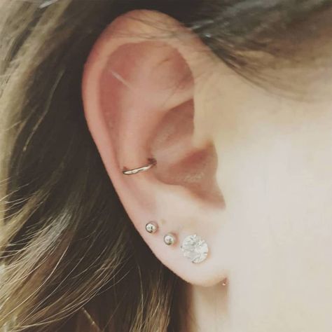 Snug Piercing Ideas, Triple Lobe, Piercing Snug, Different Ear Piercings, Unique Ear Piercings, Snug Piercing, Types Of Ear Piercings, Pretty Ear Piercings, Cute Ear Piercings