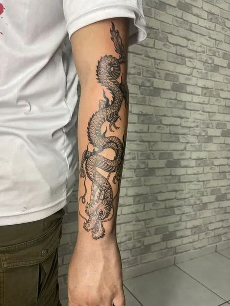 Dragon Tattoos 2024: Bold designs for men 18 ideas Dragon Tattoo Forearm, Tattoo After Care, Dragon Tattoo Stencil, Black Dragon Tattoo, Hellboy Tattoo, Dragon Tattoo Arm, Tattoo Ideas Unique, Tattoo Artist Tattoo, Dragon Tattoos For Men