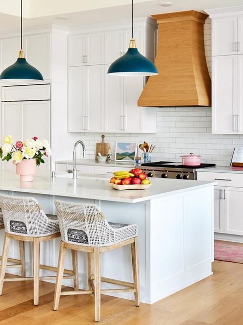 Contemporary White Kitchen With Colorful Accents | HGTV White Modern Kitchen Pops Of Color, White Kitchen Pops Of Color, Kitchen Pops Of Color, Modern Eclectic Kitchen, Contemporary White Kitchen, Wood Range Hood, Eclectic Kitchen, Kitchen Things, White Modern Kitchen