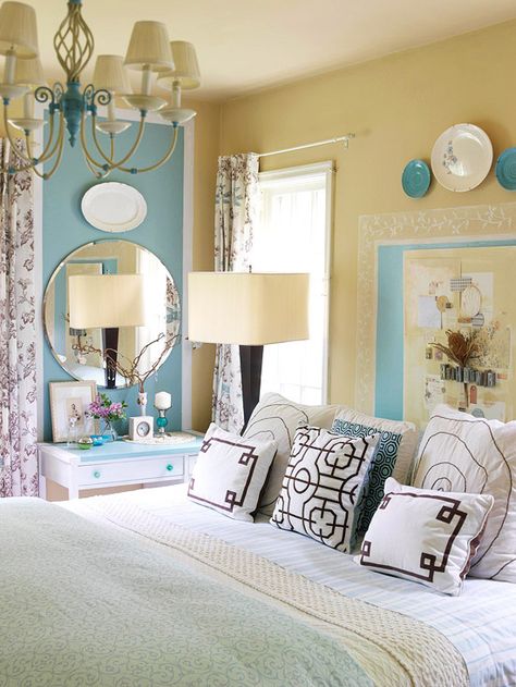 To maintain a light and airy look, use blue as an accent in a space filled with neutral hues. In this white and sandy yellow bedroom, a country French blue infuses the space with subtle personality. While the combination could easily lean antique cottage, the color palette is kept up-to-date with contemporary florals and geometric motifs. Also, love the vanity Cottage Cozy, Yellow Bathroom Decor, House Of Turquoise, Cottage Bedroom, Bedroom Photos, Mirror On The Wall, Yellow Bedroom, Yellow Bathrooms, Woman Bedroom