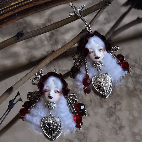 These Vampire Princess II Gothic Doll Jewelry are a unique and striking addition to any gothic or Art Doll collection. Handcrafted by our skilled artisans, each piece is made with ultra-light clay, resin clay, wool or rayon, and metal fittings. The result is a lightweight earring that is comfortable to wear all day long. These earrings are designed with a creepy cute doll aesthetic and measure approximately 8x3.4 cm (3.15 x 1.34 inches) in size. Please note that the price is for a single earring or brooch, and if you want a pair of earrings, please order two. To take care of your earrings, avoid soaking, squeezing, tearing, rubbing, or scratching them, and store them in a box when not wearing them. Vampire Doll Aesthetic, Gothic Resin Art, Spooky Jewelry, Creepy Cute Aesthetic, Doll Earrings, Vampire Princess, Light Clay, Stud Earrings Unique, Doll Aesthetic