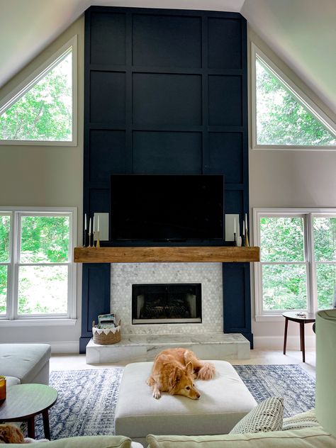 Black Trim Around Fireplace, Two Story Fireplace Wall With Windows, Black Wood Panel Fireplace Wall, Fireplace Focal Wall Ideas, Contrast Fireplace Wall, Fireplace Wall Dark Paint, Trim Wall Fireplace, Board And Batten Two Story Fireplace, Geometric Fireplace